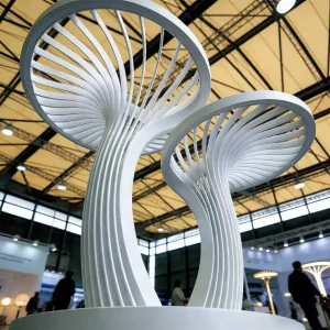 The “Cloudrise Twins” Curved Sculpture Light is an iconic lighting installation designed for modern outdoor landscapes. With its fluid, twisting silhouette and soft warm-white illumination, this artistic fixture functions both as a daytime sculpture and a nighttime lighting feature. Crafted for parks, plazas, commercial walkways, and garden spaces, the design brings together artistic landscape aesthetics and practical illumination.